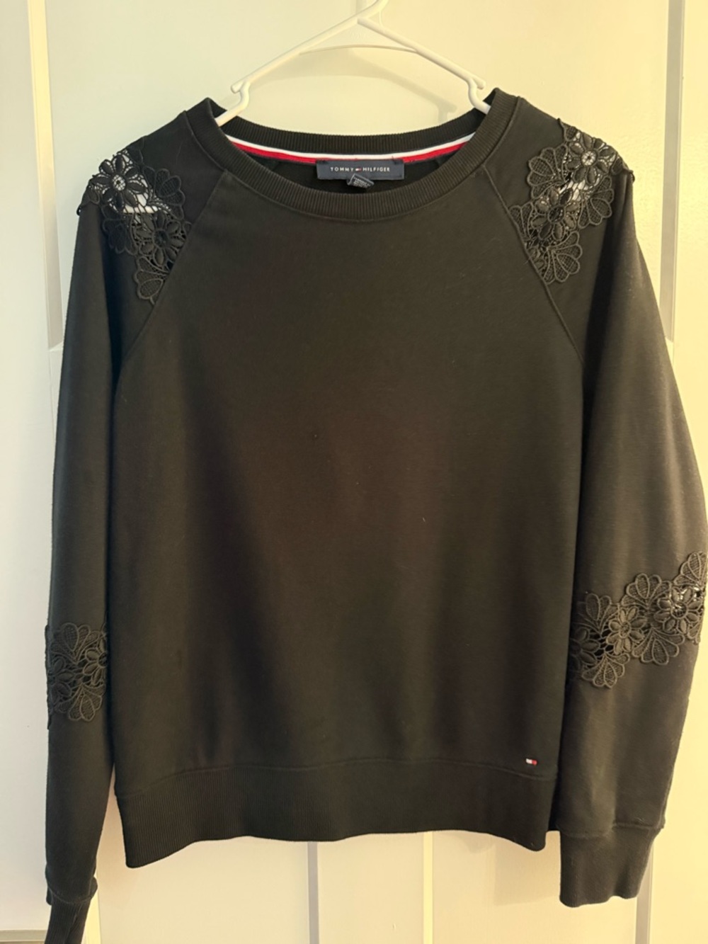 Tommy Hilfiger Black Sweatshirt with floral accents.